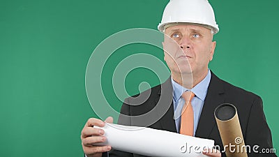 Engineer with Plans in Hands Looking Forward Stock Photo