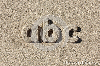 Abc written in sand letters. Stock Photo