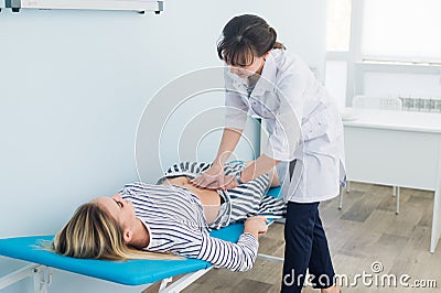 Abdominal examination, Doctor is examining the abdomen of patient Stock Photo