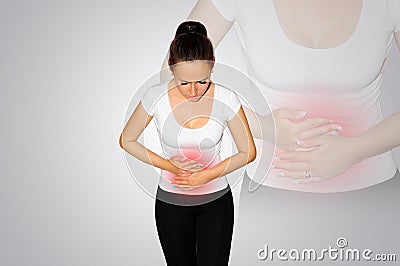 Abdominal pain. A young woman suffers from pain in the abdomen. The problem with digestion. The problem of women`s health, the co Stock Photo