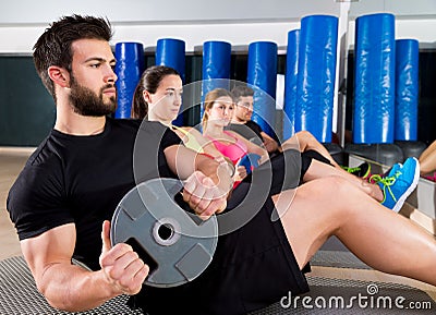 Abdominal plate training core group at gym Stock Photo