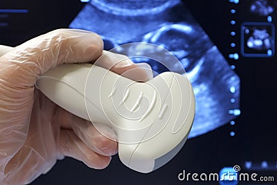 Abdominal ultrasoud probe fetus scan background Stock Photo