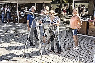 Abkhazia, tourists admire through a telescope the beauty of the Editorial Stock Photo