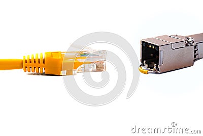 Ð¡able head into head rj45 of an ethernet wire cable or yellow patch-cord with twisted pair and SFP module,network,RJ45,plug. Stock Photo