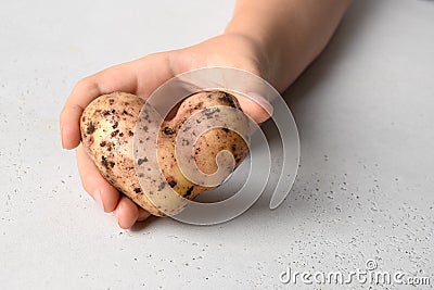 Abnormal potato in shape of heart on white. Close up Stock Photo