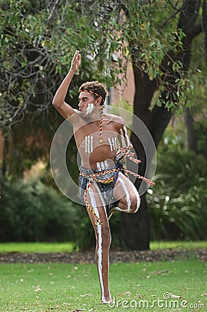 Aboriginal Australians man dancing traditional dance during Australia Day celebrations Editorial Stock Photo