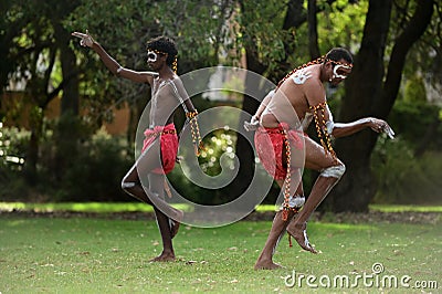 Aboriginal Australians men dancing traditional dance during Australia Day celebrations Editorial Stock Photo