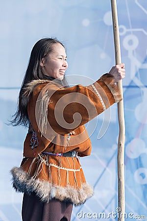 Aboriginal female emotional dancing with spear in national clothes indigenous people. Kamchatka Koryak National Dance Editorial Stock Photo