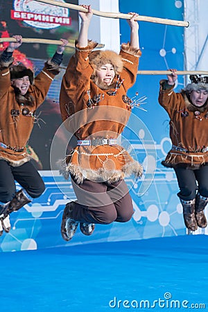 Aborigine female dancer jumping in national clothes of indigenous people Kamchatka Peninsula. Koryak National Dance Editorial Stock Photo