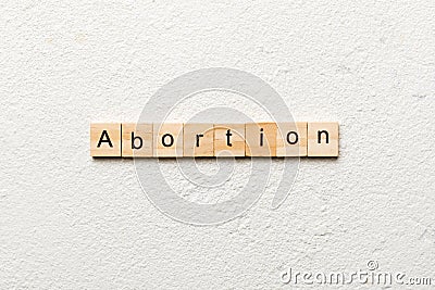 abortion word written on wood block. abortion text on table, concept Stock Photo