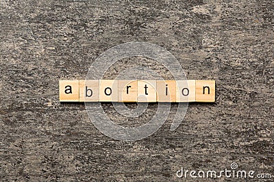 abortion word written on wood block. abortion text on table, concept Stock Photo