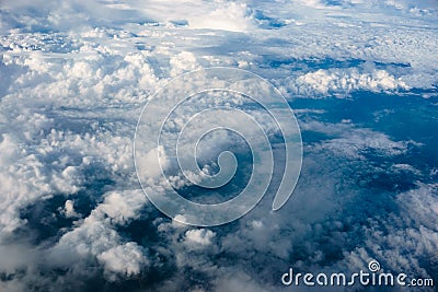 Above heaven, view from airplane to fluffy white clouds and blue atmosphere, nature skyline landscape Stock Photo