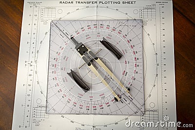 Above image of a navigator's radar plotting chart with a triangle and compass divider Stock Photo