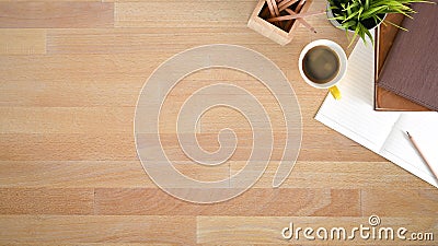 Above table with notebook paper, pencil and coffee on wooden desk with top view Stock Photo