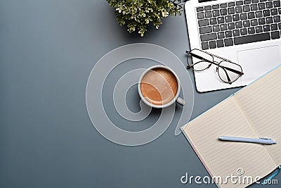 Coffee cup, laptop computer an empt notebook on blue background. Stock Photo