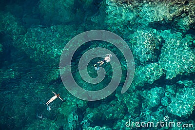 Couple snorkeling in the sea Stock Photo