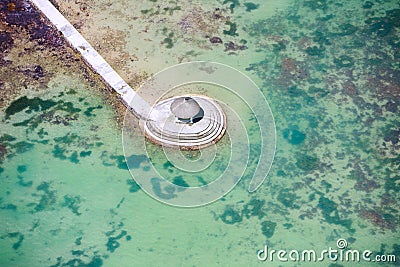 Above view of long jetty in ocean Stock Photo