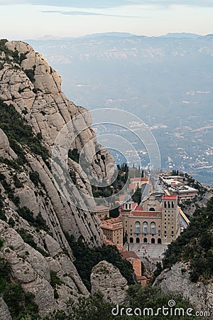 Above view of the Monastery of Montserrat, Spain, from the top of the mountain through the canyon on sunset. Stock Photo