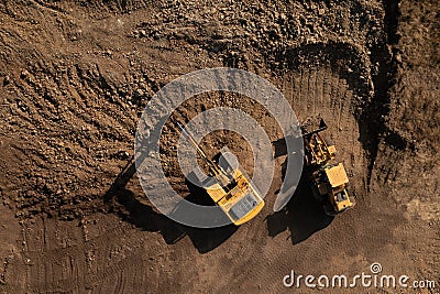 Above view of two heavy excavators during earth works Stock Photo