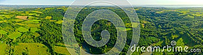 Aerial panoramic view of over green hilly landscape Stock Photo