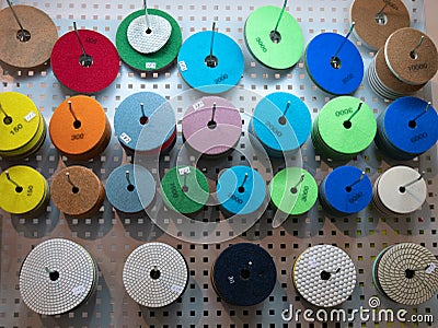 Abrasive circles for industrial equipment power tools for grinding, cutting or polishing at DIY hardware store warehouse. Stock Photo