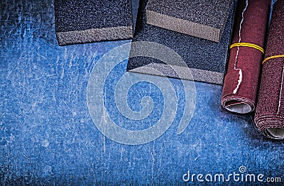 Abrasive sponges paper on scratched metallic background construc Stock Photo
