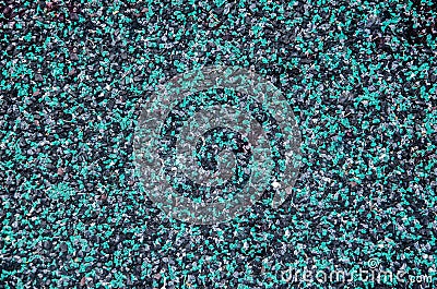 Abrasive texture roofing material close-up. Abstract colored granular background. Stock Photo