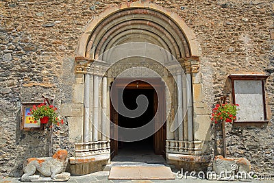 The main entrance of Saint Pierre and Saint Antoine church, with carvings, columns and two lions statues, located in Abries Editorial Stock Photo
