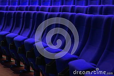 Absolutely empty blue chairs in cinema with nobody Stock Photo