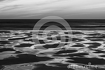 Absolutely stunning landscape images of Holywell Bay beach in Cornwall UK during golden hojur sunset in Spring Stock Photo