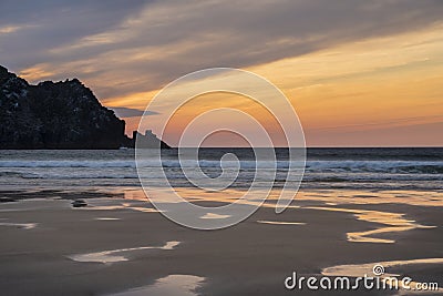 Absolutely stunning landscape images of Holywell Bay beach in Cornwall UK during golden hojur sunset in Spring Stock Photo