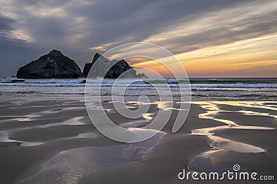 Absolutely stunning landscape images of Holywell Bay beach in Cornwall UK during golden hojur sunset in Spring Stock Photo