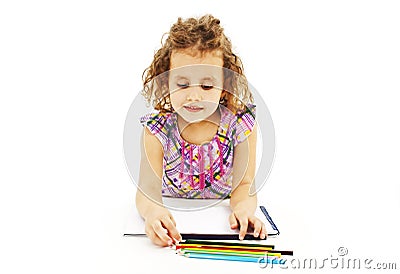 Absorbed little girl drawing with colorful pencils Stock Photo