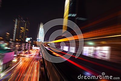 Abstract acceleration speed motion light Blur from Sky Train at night Stock Photo
