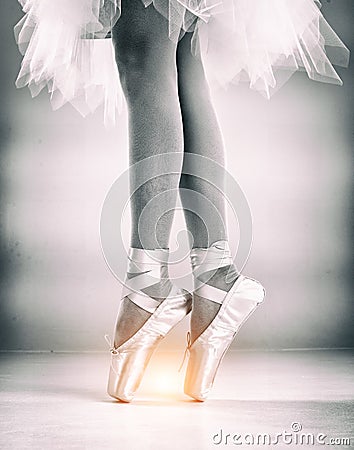 The abstract art design background of the lady legs with ballet shoes, standing with toes,for ballet basic pattern,vintage and art Stock Photo