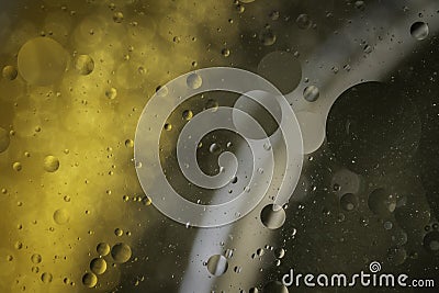 An abstract artistic close up macro photo created by mixing oil and water then back lit with a golden flash Stock Photo