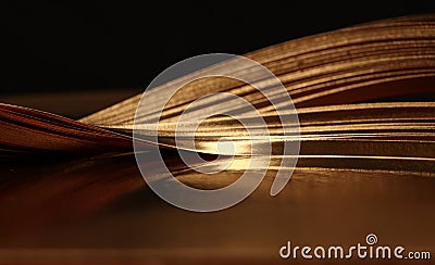 Abstract backgound. Gold bronze paper wave on black Stock Photo