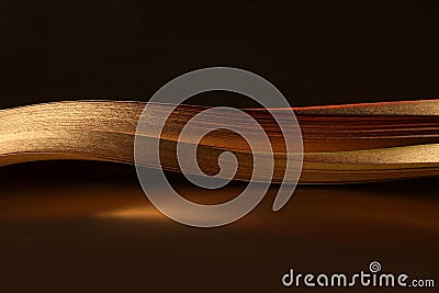 Abstract backgound. Gold bronze wave on dark brown Stock Photo