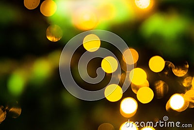 Abstract background with blurred golden lights. Glowing effect. Gold bokeh of light textured glitter background. Christmas party , Stock Photo