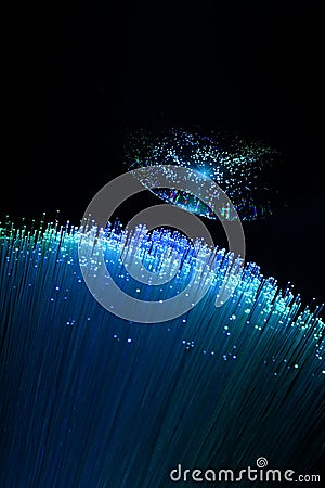 Abstract background with colored fibers optics reflected on glass sphere Stock Photo