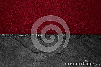 Abstract background composition of divided in the half matt vivid burgundy color paper and black stone with copy space Stock Photo