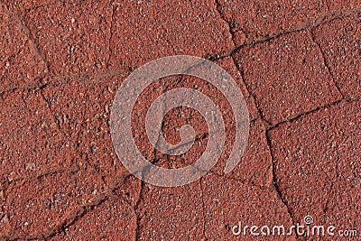 Cracked red asphalt pavement Stock Photo