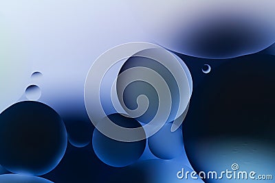 Abstract background in deep blue color with oil drops in water, macro. Science, biology and biotechnology concept Stock Photo