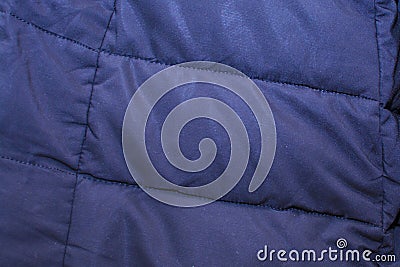 Abstract background of fabric with stitches. Fragment of clothes. Stock Photo