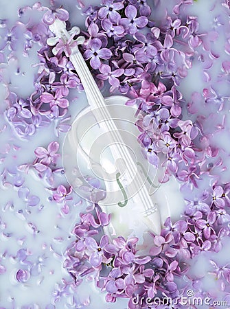 Abstract background with lilac flowers and white miniature violin Stock Photo