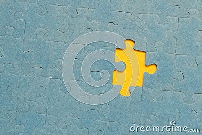 Abstract background of many puzzles on a yellow background. The concept of teamwork Stock Photo