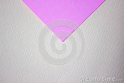 Abstract background of minimalism texture of colored paper. Pink triangle on a yellow background. Minimal geometric shapes Stock Photo