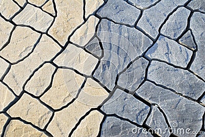 Abstract background paving consisting of irregular stones Stock Photo