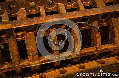 Rusty elements background. Orange brown rusted Ingots of a heavy metal. Details of mechanism Stock Photo