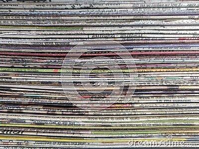 Abstract background of sideview of stack of used newspapers. Stock Photo